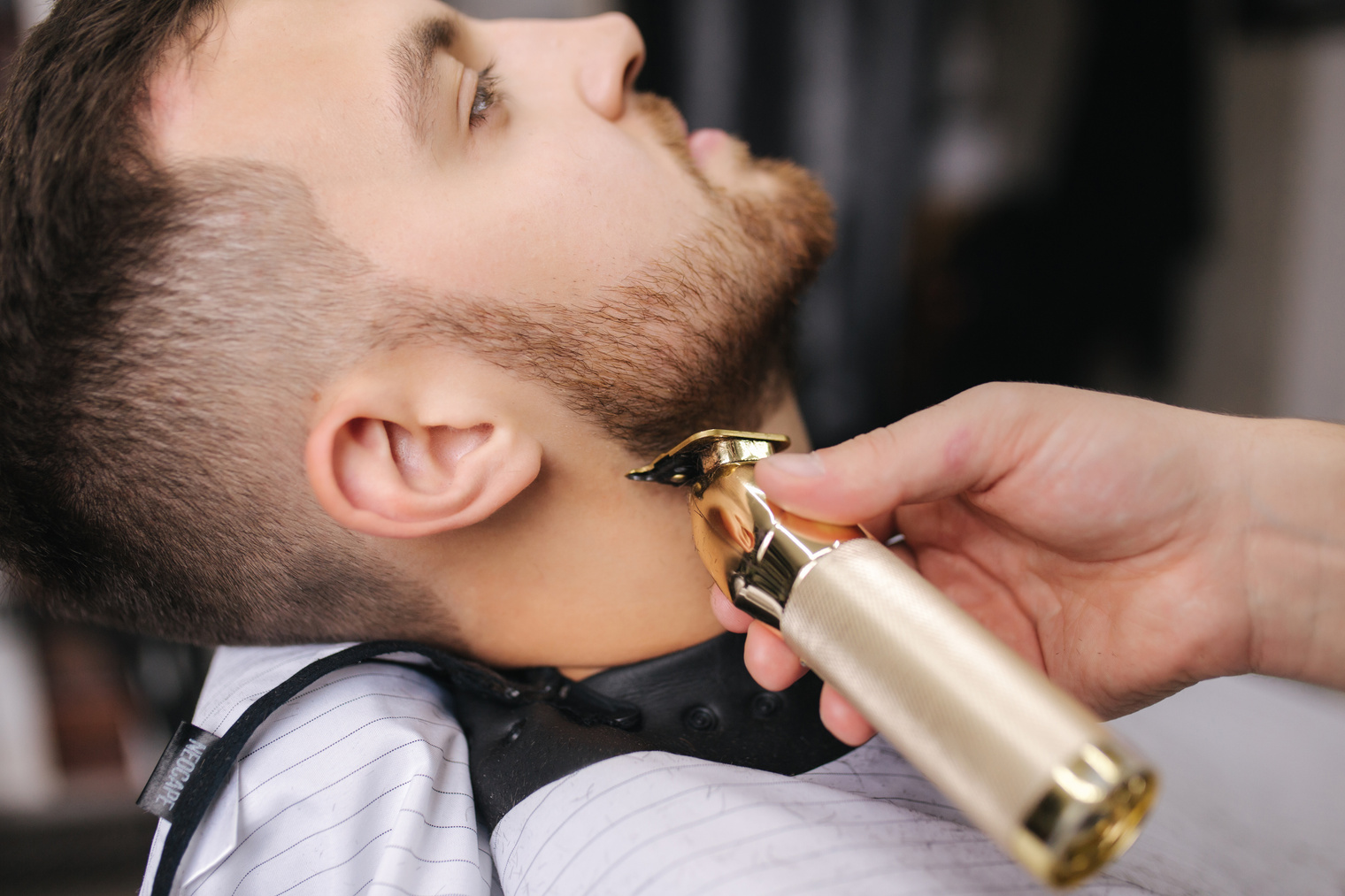 Man Getting His Beard Trimmed