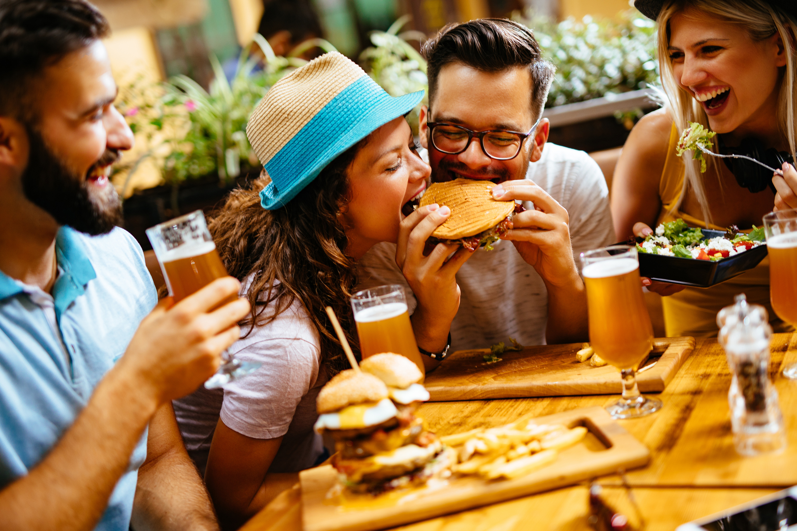 Friends eating fast food in a restaurant