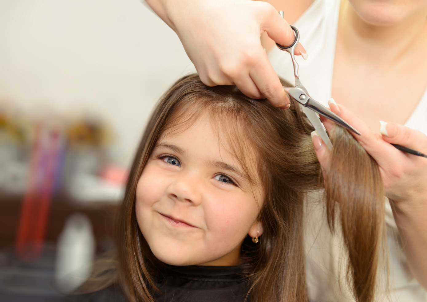 happy girl cutting hair