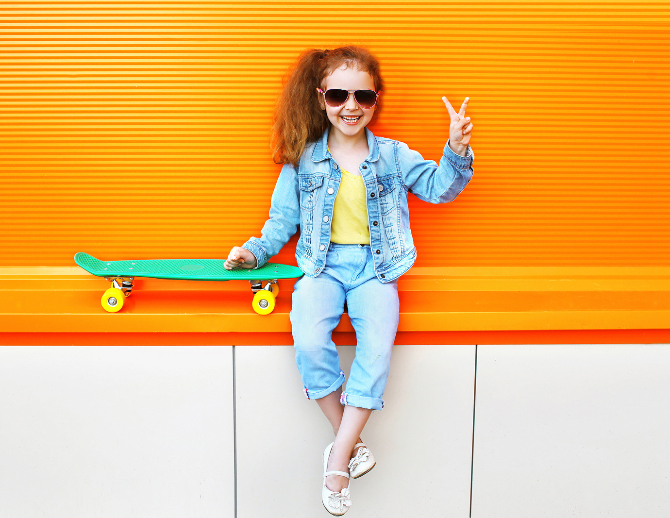 Fashion kid. Stylish little girl child wearing a jeans clothes